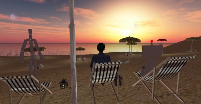 図２．砂浜の椅子に座って夕陽を眺める